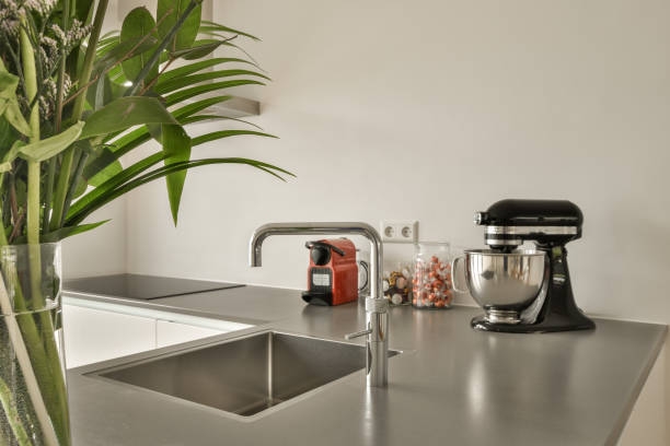 istock a kitchen counter top with a sink and a mixer 1496974903