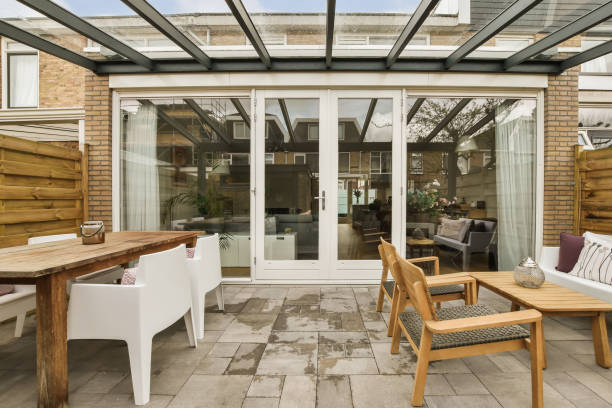 istock a patio with glass doors and a table and chairs 1496974920