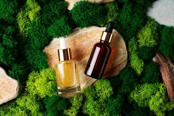 istock Cosmetic mock up with stone and moss, beauty concept with serum bottle 1496975189