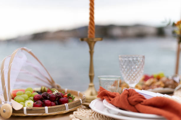 istock Fruits in a table ready for meal in the seafront 1496977415
