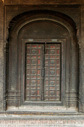 Pakistan, Lahore - March 27, 2005: Wooden gate in Lahore Fort