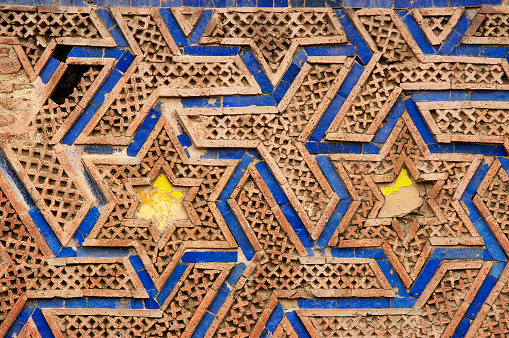 Pakistan, Lahore - March 27, 2005: Star figures built on the wall in Lahore Fort
