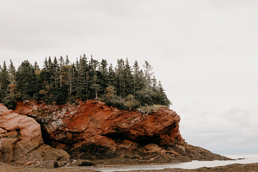 Beautiful Bay of Fundy beach with an exposed seabed during low tide in New Brunswick. Focus on foreground. Shot with a Canon 5D Mark IV.