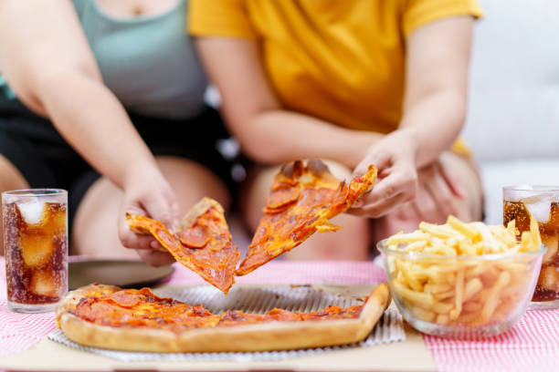 istock Asian fat women enjoy eating together. 1496981591