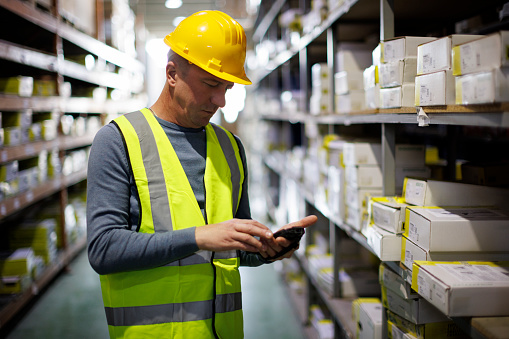 Warehouse Worker Scanning Boxes With Bar Code Scanner Stock Photo ...