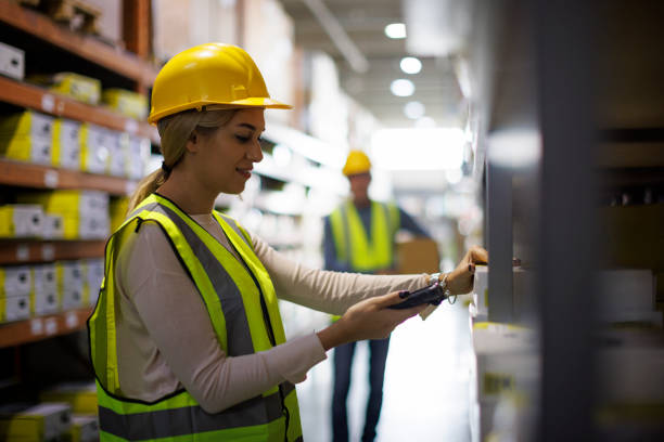 Female warehouse worker scanning boxes with bar code scanner Female warehouse worker scanning boxes with bar code scanner bar code reader radio frequency identification warehouse checklist stock pictures, royalty-free photos & images