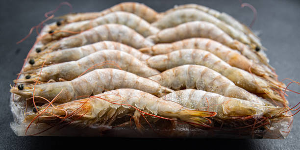 frozen shrimp raw gambas seafood prawn meal food snack on the table copy space food background rustic top view frozen shrimp raw gambas seafood prawn meal food snack on the table copy space food shrimp cocktail stock pictures, royalty-free photos & images