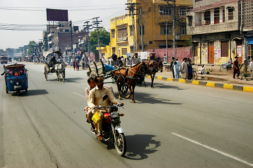 Pakistan, Lahor - March 27, 2005 : Mixed vehicles on a busy street in Lahore