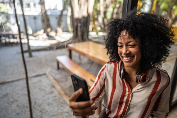 istock Young businesswoman using mobile phone at office/coworking 1496984981