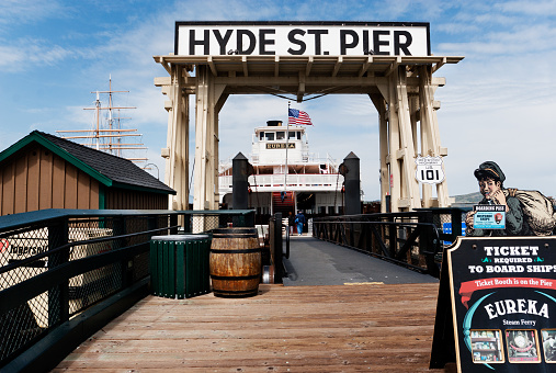 San Francisco , California, USA -  April 1, 2008 - Entrance to the Hyde Street Pier, San Francisco Maritime National Historical Park, in San Francisco's Fisherman's Wharf neighborhood. The Eureka, an 1890 sidewheel paddle steamboat,  is one of several historic ships in the park.