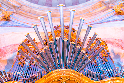 organ with details of the pipes inside the national pantheon, church of santa engracia, colored lighting.  Lisbon