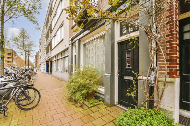 istock a brick sidewalk outside a building with bikes parked outside 1496989509