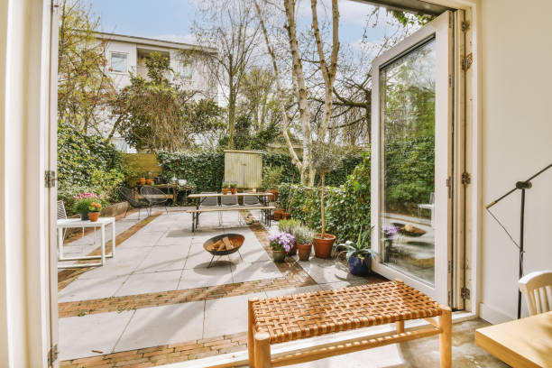 istock a small backyard with a patio and a large window 1496989534