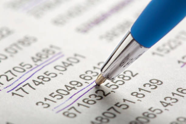 istock Checking the value of securities. Pen, share listing and checking financial chart. Concept of banking, financial report and financial audit. 1496991263