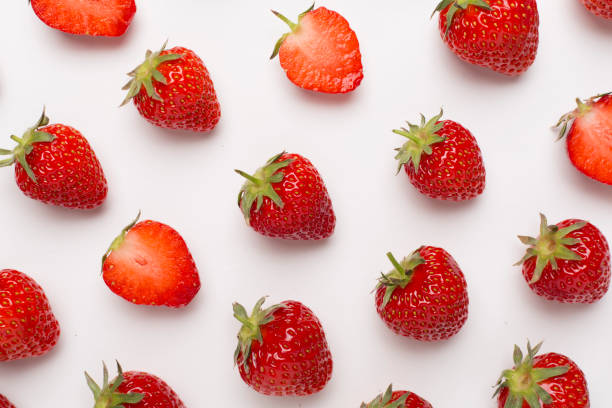istock Strawberries with leaves on white background, top view 1496993216