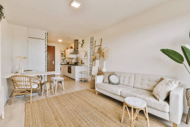 istock a living room with a white couch and a table 1496993673