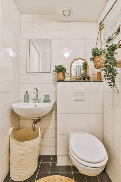 istock a white bathroom with a white toilet and a sink 1496993689
