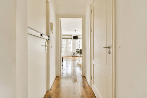 istock a hallway with white doors and a hard wood floor 1496997539