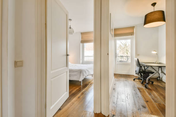 istock a bedroom with a bed and a desk and a 1496997582