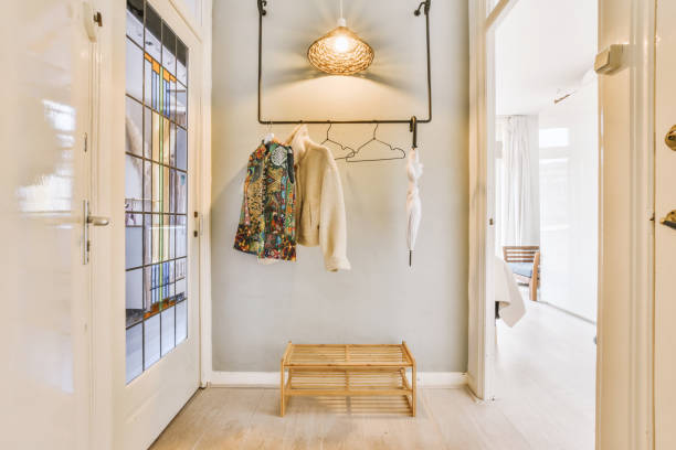 istock a hallway with a wooden bench and a white wall 1497000734