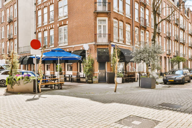 istock a street corner with tables and umbrellas 1497001039