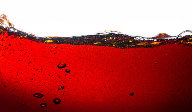istock Macro cola background on white background,Macro cola background on white background, side view background of refreshing cola soda with air bubbles isolated on white. 1497003006