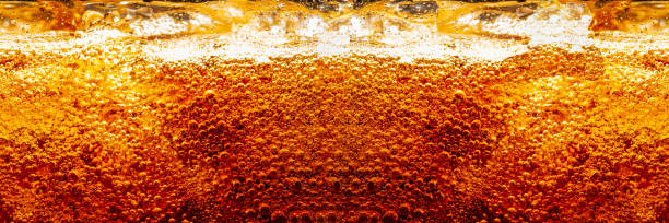 istock cola texture,Cola and Ice, food background, Cola close-up, design element. Beer. Macro bubbles, ice, bubbles, background, ice cubes, abstract background. 1497003138