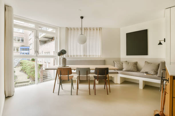 istock a living room and dining area with a large window 1497003748