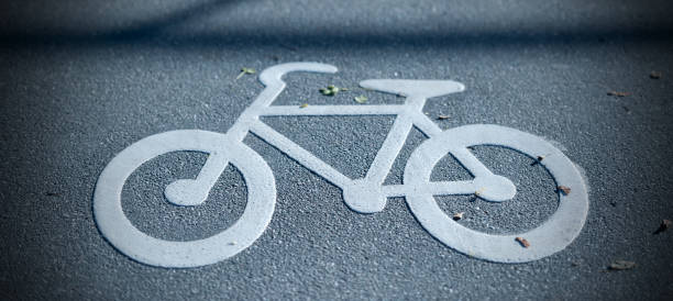 istock Bike lane symbol painted on asphalt 1497007627