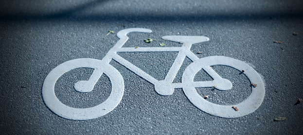 Bike lane symbol painted on asphalt