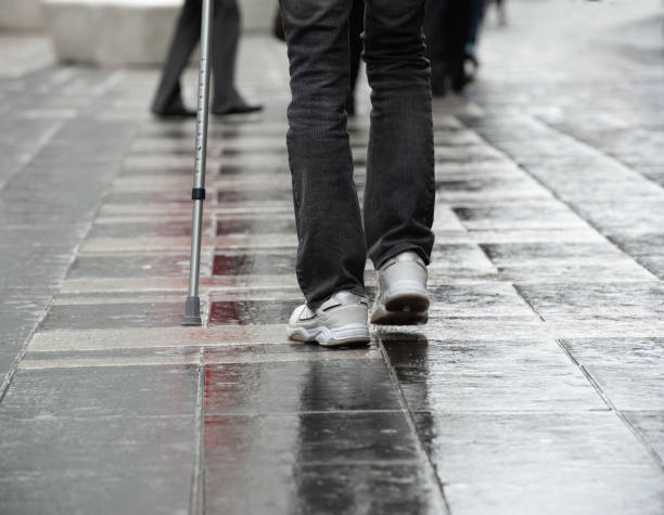 istock Disabled man walking on rainy street 1497007811