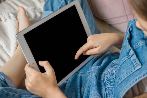 istock Girl with tablet in hands 1497015605