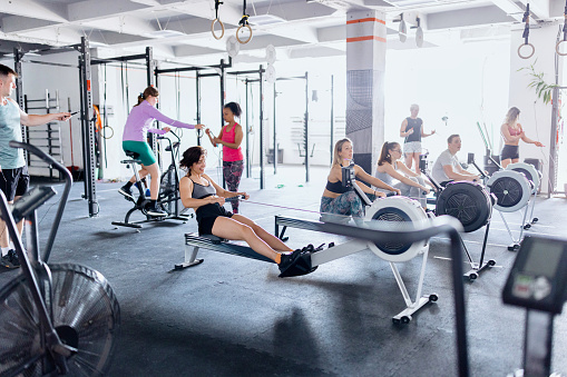 Beautiful group of people working out in the gym