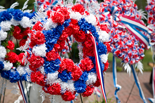 Memorial Day wreaths in a town park, USA remembrance and honor of war dead.