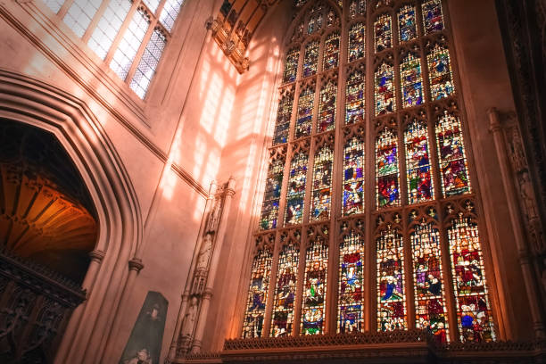 Cathedral Interior, Church interior, sun light pass through the beautiful stained glass windows  in UK Bath Cathedral interior, Bath Abbey, Abbey Church of Saint Peter and Saint Paul bath abbey stock pictures, royalty-free photos & images