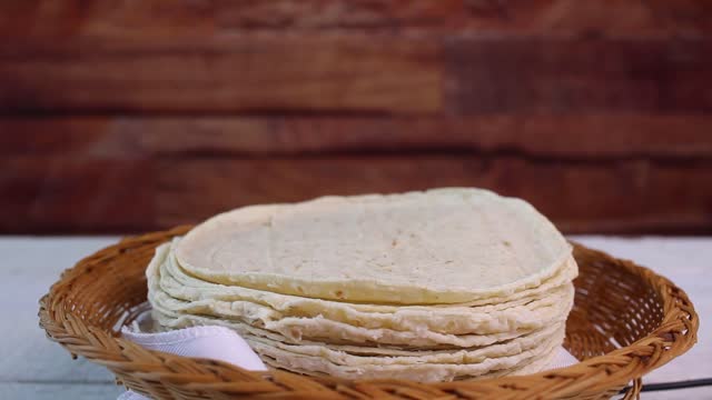 corn tortillas turning slowly on plate. Mexican food