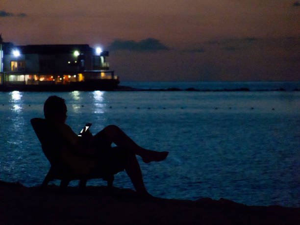San Andres Island, Colombia - May 24th 2023: During the sunset, the common people in the beach are enjoying the place. Recently the island has been suffer low tourism demand.