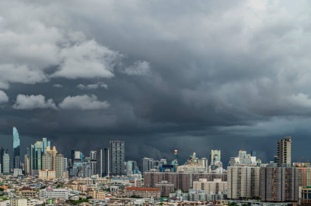 A heavy storm with rain and dramatic atmosphere clouds can be a sight to behold over a city center.