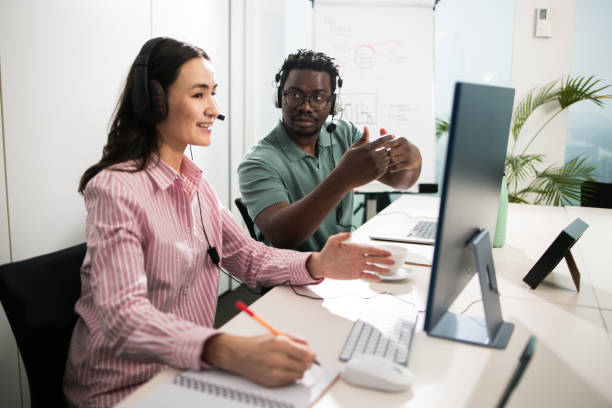 istock Two colleagues working at the office for customer service 1497043613