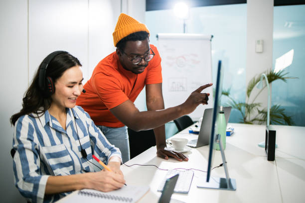 istock African man and his Asian colleague cooperating on a project 1497043646