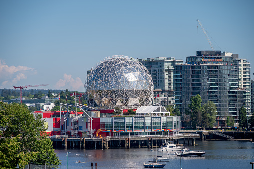 Vancouver, British Columbia - May 26, 2023: Science World exterior above False Creek in Vancouver.