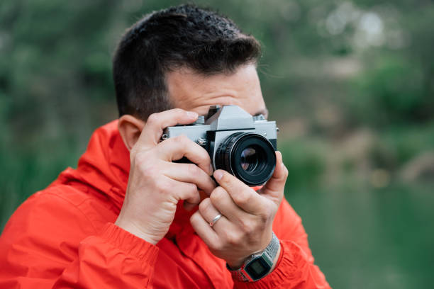 istock Taking nature photos with an analog camera 1497055042