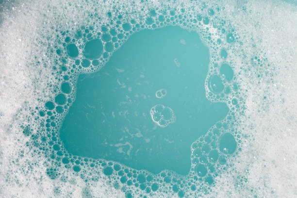 istock Detergent foam bubble on wate. Blue background, Soap sud 1497057178