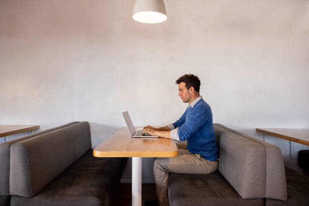 istock Business man working on his laptop at a coworking office 1497057582