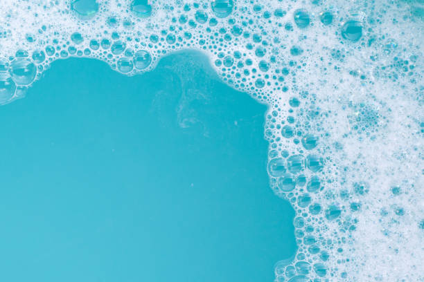 istock Detergent foam bubble on wate. Blue background, Soap sud 1497059488