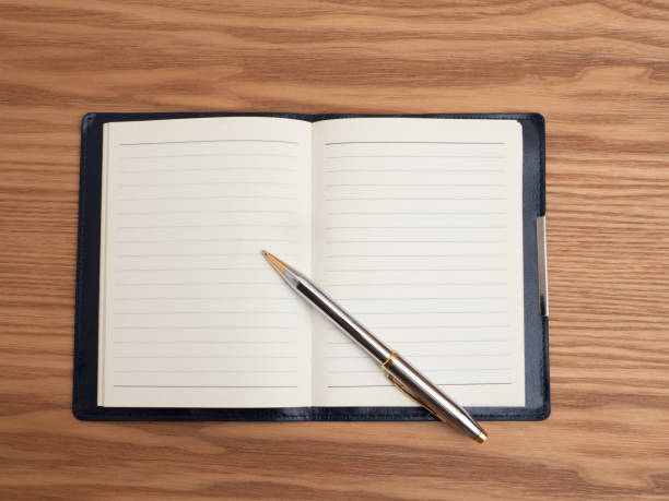 istock A notebook and a ballpoint pen spread out on the table 1497074762