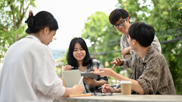 istock A group of smart Asian college students enjoy talking or sharing ideas on their project 1497078084