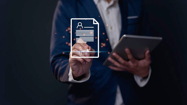istock In corporate accounting, managers assess employee performance using KPIs and quality reports. Once approved, employees sign contracts and documents to confirm their acceptance of work agreements. 1497078437