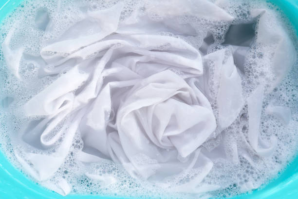 istock Soak a cloth before washing, white cloth 1497078484