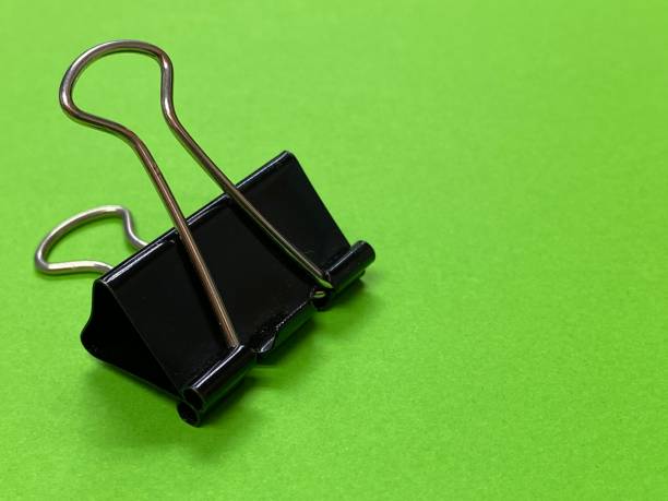 istock Black paperclip with black background 1497086981